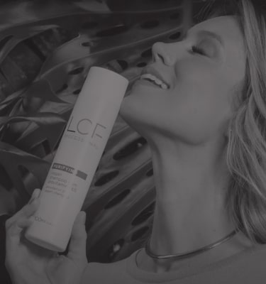 Woman smiling and holding a LOF product